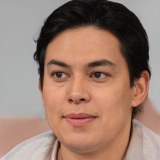 Joyful asian young-adult male with short  brown hair and brown eyes