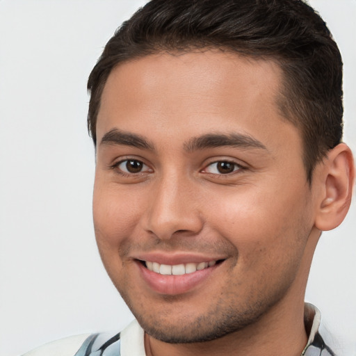 Joyful white young-adult male with short  brown hair and brown eyes