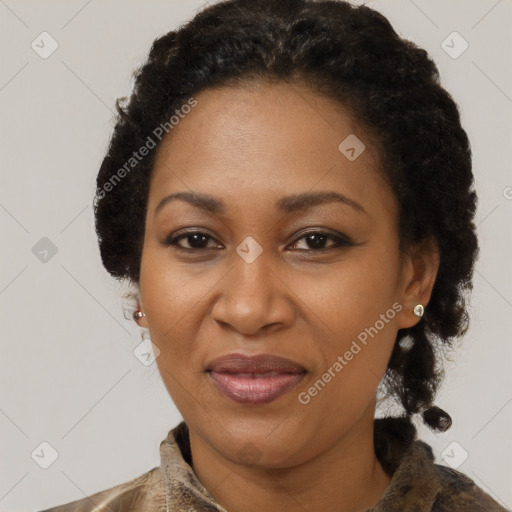 Joyful black adult female with short  brown hair and brown eyes