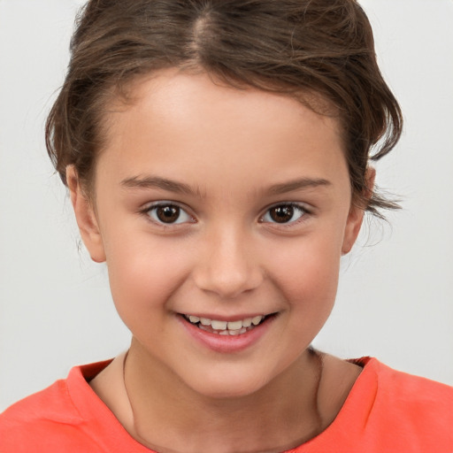 Joyful white child female with short  brown hair and brown eyes