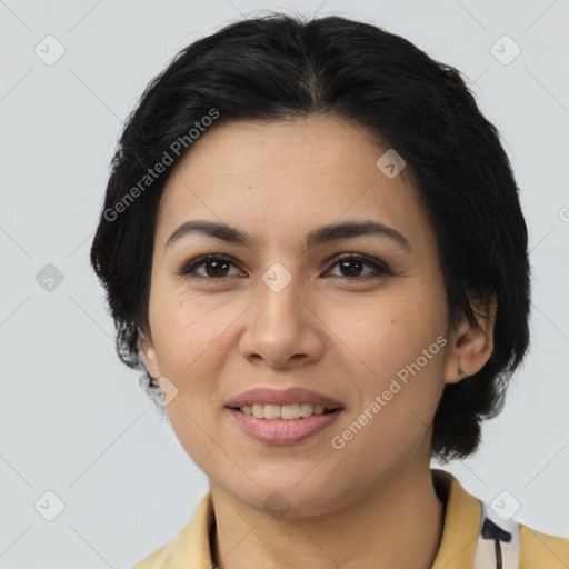 Joyful latino young-adult female with medium  brown hair and brown eyes