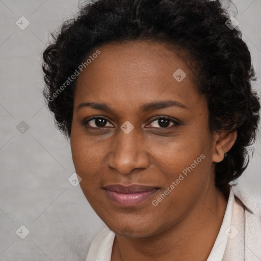 Joyful black adult female with short  brown hair and brown eyes