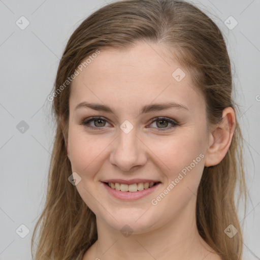 Joyful white young-adult female with long  brown hair and grey eyes