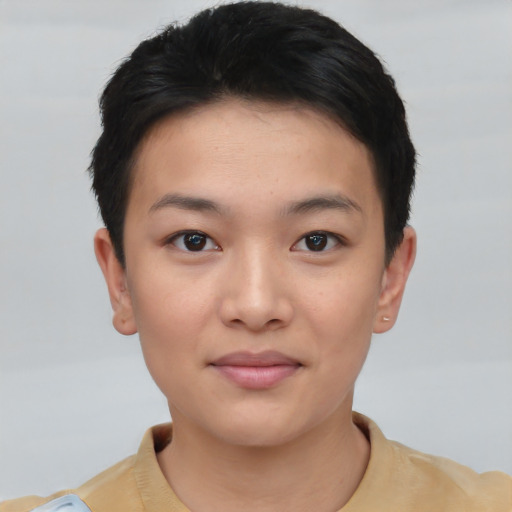Joyful asian young-adult female with short  brown hair and brown eyes