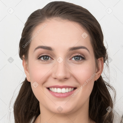 Joyful white young-adult female with long  brown hair and grey eyes