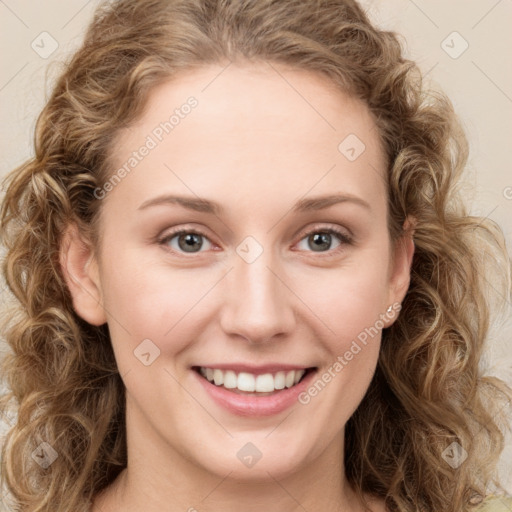 Joyful white young-adult female with long  brown hair and green eyes