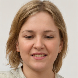 Joyful white young-adult female with medium  brown hair and blue eyes