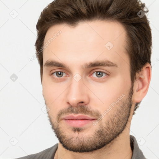 Neutral white young-adult male with short  brown hair and brown eyes