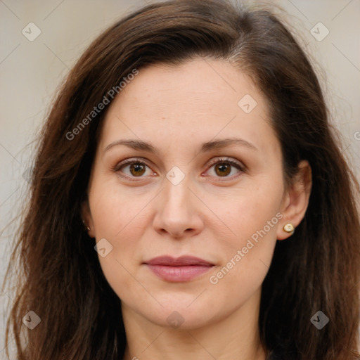 Joyful white adult female with long  brown hair and brown eyes