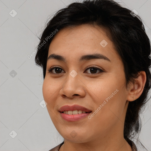 Joyful latino young-adult female with medium  brown hair and brown eyes