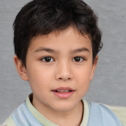 Joyful white child male with short  brown hair and brown eyes