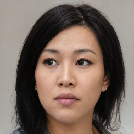 Neutral asian young-adult female with medium  black hair and brown eyes