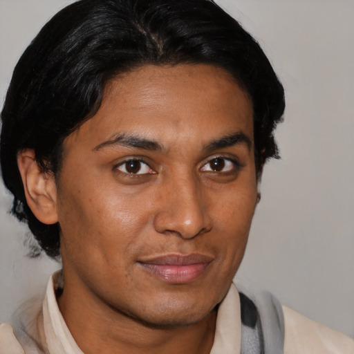 Joyful asian young-adult male with short  brown hair and brown eyes