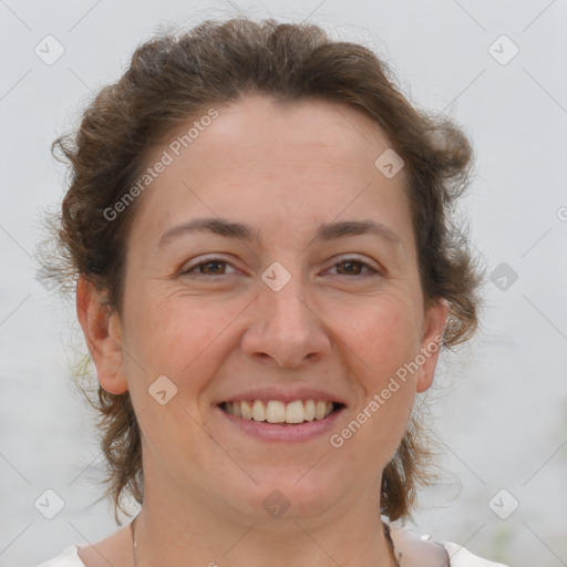 Joyful white adult female with short  brown hair and brown eyes