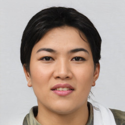 Joyful asian young-adult female with short  black hair and brown eyes