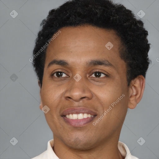 Joyful black young-adult male with short  black hair and brown eyes