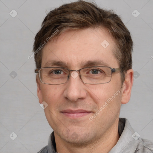 Joyful white adult male with short  brown hair and grey eyes