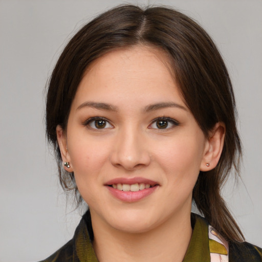 Joyful white young-adult female with medium  brown hair and brown eyes