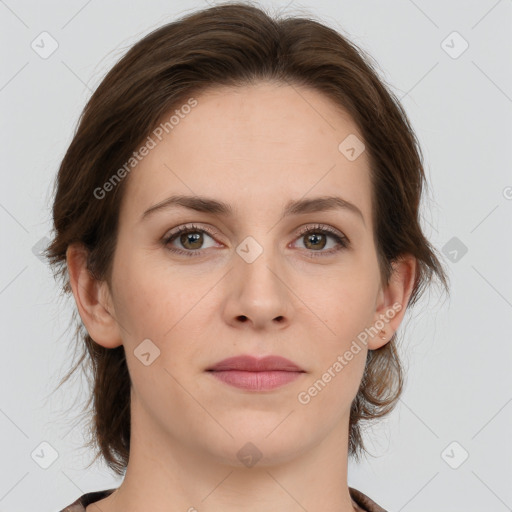 Joyful white young-adult female with medium  brown hair and green eyes