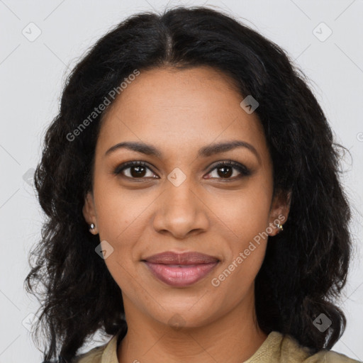 Joyful black young-adult female with long  brown hair and brown eyes