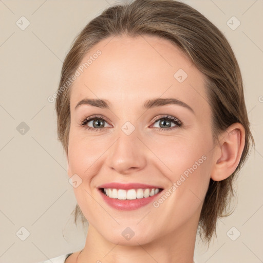 Joyful white young-adult female with medium  brown hair and green eyes