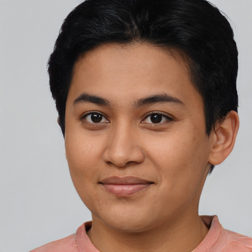 Joyful asian young-adult female with short  black hair and brown eyes