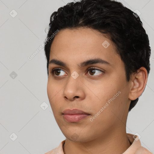 Neutral latino young-adult male with short  black hair and brown eyes