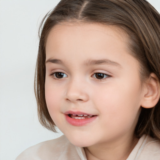 Joyful white child female with medium  brown hair and brown eyes