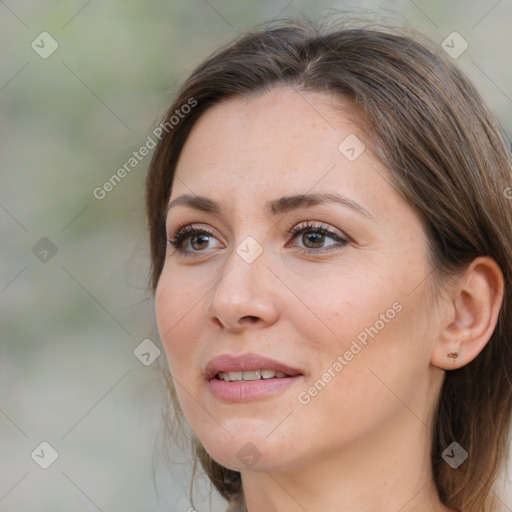 Joyful white adult female with medium  brown hair and brown eyes