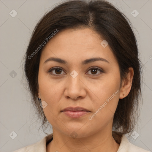 Joyful white adult female with medium  brown hair and brown eyes