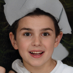 Joyful white child female with short  brown hair and brown eyes