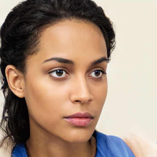 Neutral latino young-adult female with long  brown hair and brown eyes