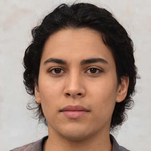 Neutral latino young-adult female with medium  brown hair and brown eyes
