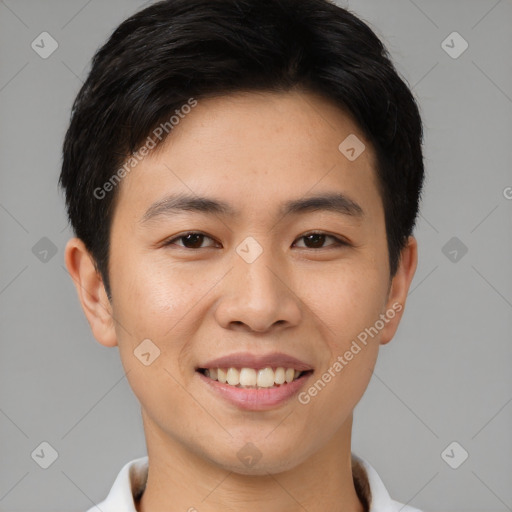 Joyful asian young-adult male with short  black hair and brown eyes