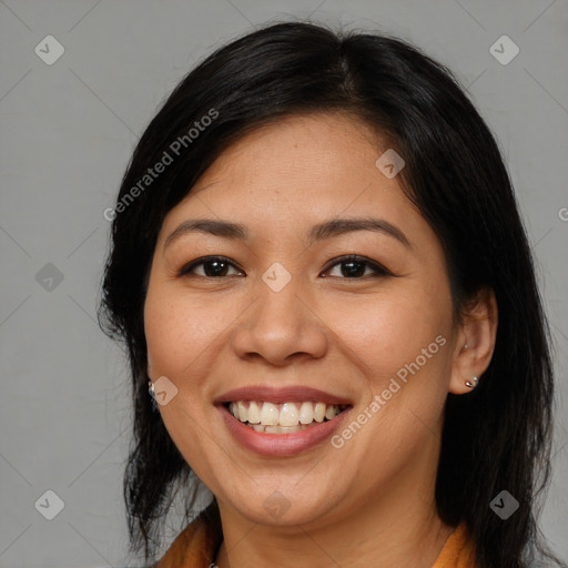 Joyful asian young-adult female with long  brown hair and brown eyes