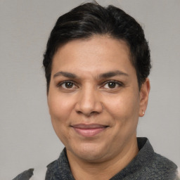 Joyful white adult female with short  brown hair and brown eyes