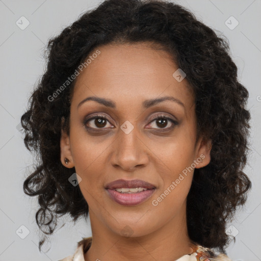 Joyful black young-adult female with medium  brown hair and brown eyes