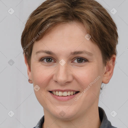 Joyful white young-adult female with short  brown hair and grey eyes