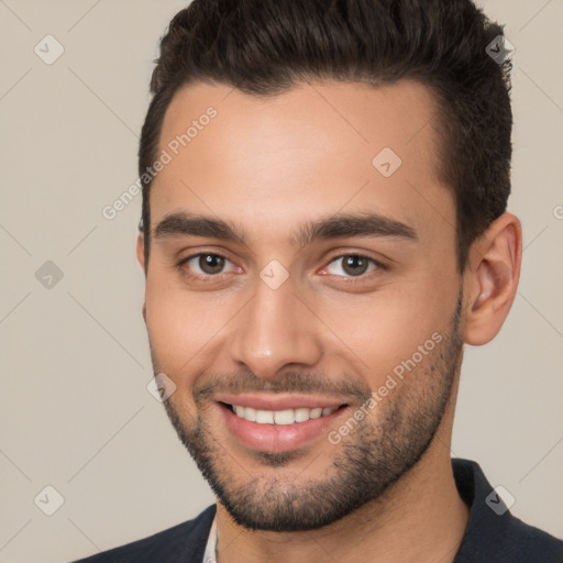 Joyful white young-adult male with short  brown hair and brown eyes