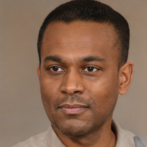 Neutral black young-adult male with short  black hair and brown eyes