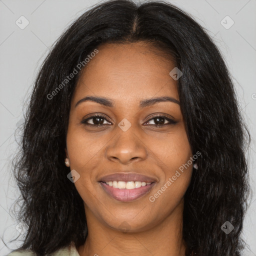 Joyful black young-adult female with long  brown hair and brown eyes