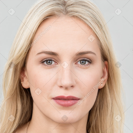 Joyful white young-adult female with long  brown hair and blue eyes