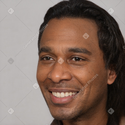 Joyful black adult male with short  black hair and brown eyes