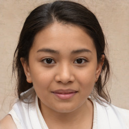 Joyful white child female with medium  brown hair and brown eyes