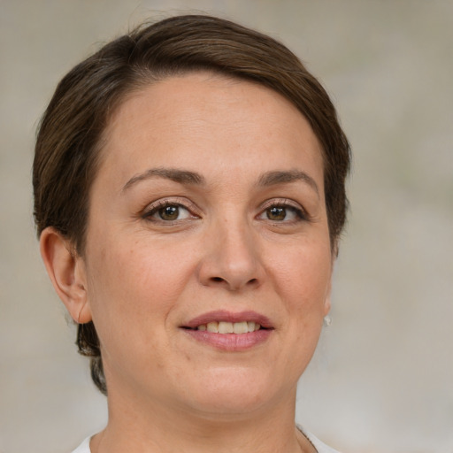 Joyful white adult female with short  brown hair and brown eyes