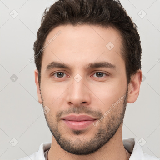 Neutral white young-adult male with short  brown hair and brown eyes