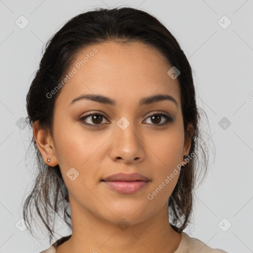 Joyful latino young-adult female with medium  brown hair and brown eyes