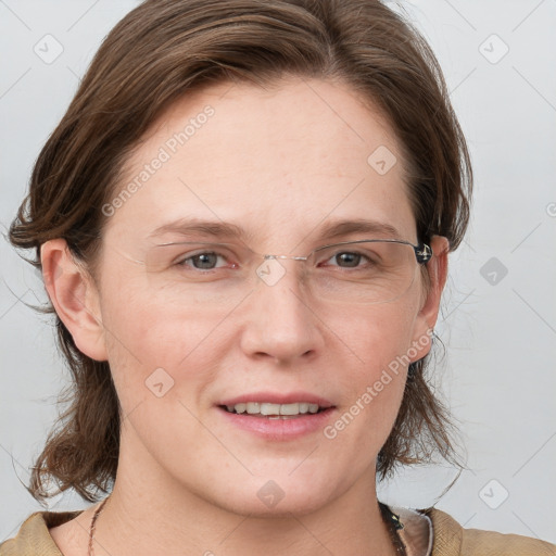 Joyful white adult female with medium  brown hair and grey eyes