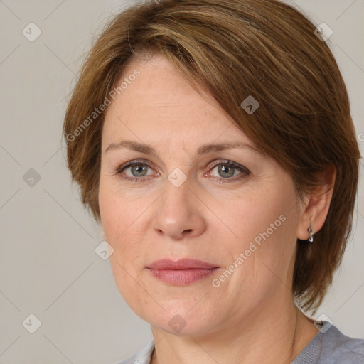 Joyful white adult female with medium  brown hair and grey eyes