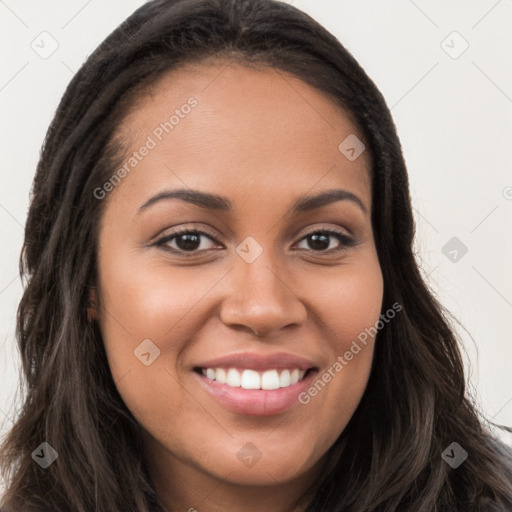 Joyful latino young-adult female with long  brown hair and brown eyes